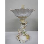 A porcelain table centrepiece featuring cherubs.