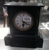 A black slate mantle clock