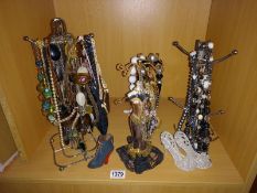 A selection of display stands & quantity of costume jewellery necklaces