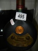 A bottle of Armagnac VSOP brandy.