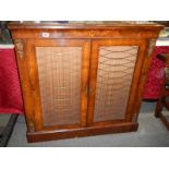 A Victorian mahogany inlaid two door cabinet with brass grills to doors. COLLECT ONLY.