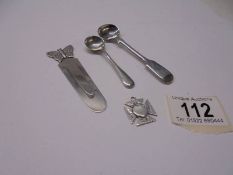 A silver salt spoon, mustard spoon, bookmark and fob, 33.7 grams.