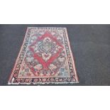 A pink patterned rug - 128cm x 192cm (COLLECT ONLY)