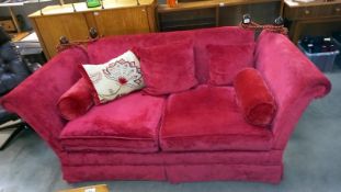 A deep red Draylon drop end settee COLLECT ONLY.