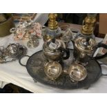 A silver plated tea set on tray & other items including candelabra dishes etc.