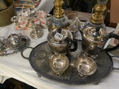 A silver plated tea set on tray & other items including candelabra dishes etc.