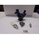Two Victorian silver whistles, a rare small boar's head pot whistle and a Staffordshire bird whistle