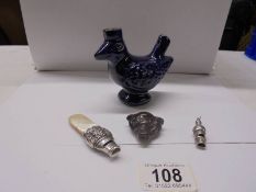 Two Victorian silver whistles, a rare small boar's head pot whistle and a Staffordshire bird whistle