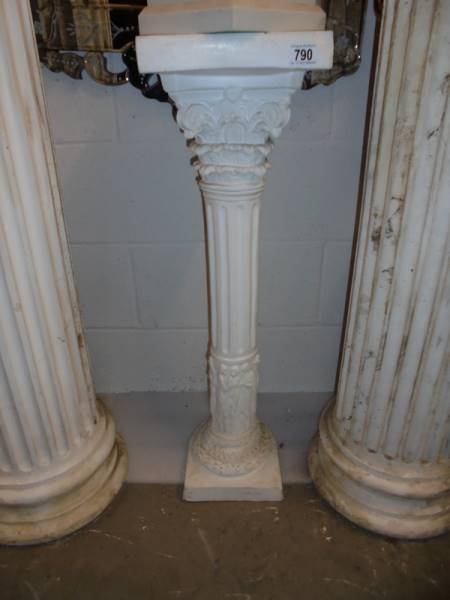 A white plaster pedestal. COLLECT ONLY.