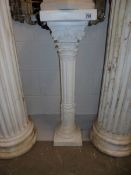 A white plaster pedestal. COLLECT ONLY.