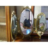 A triple dressing table mirror.