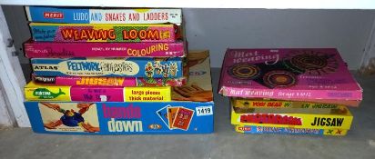A quantity of vintage jigsaws & board games etc.