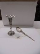 An Asian silver spill vase and spoon.