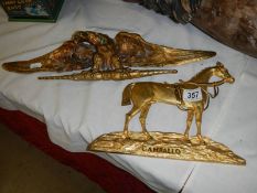 A gilded horse 'Camballo' and a gilded eagle.