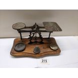 A set of Victorian brass postal scales with weights,