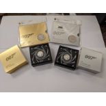 007 coins including a boxed half ounce silver Pay Attention 007 and Shaken Not Stirred 007