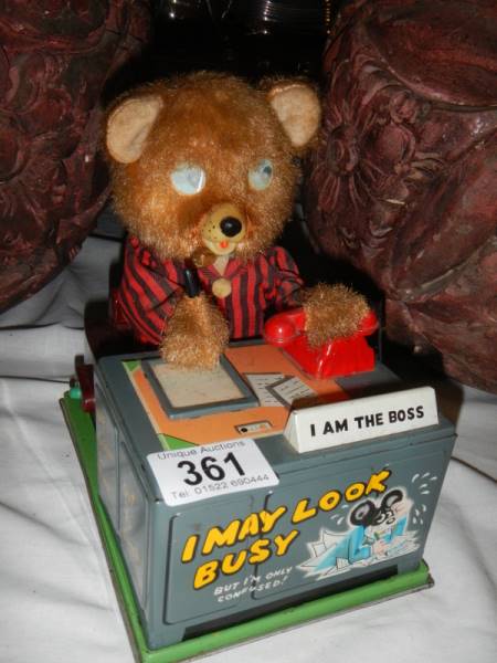 A battery operated bear at desk, 'I'm the Boss'.