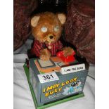 A battery operated bear at desk, 'I'm the Boss'.