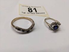 An 18ct gold blue/white stone cluster ring and a blue and white stone wishbone ring, size L & V, 5 g
