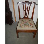 A Georgian style mahogany dining chair with embroidered seat.