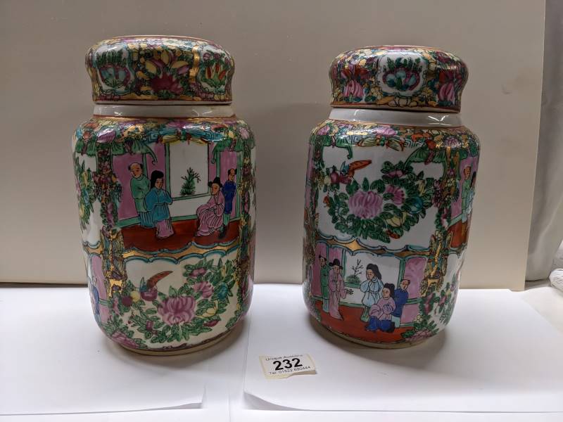 A pair of large Cantonese Famille Rose lidded ginger jars, 25.5 cm tall.