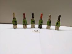 Six vintage cc12 bottles of champagne including De Thaile Decorter de Brienne.