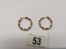 A pair of 9ct gold twisted design hoop earrings, 2.3 grams.