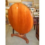 A Victorian mahogany circular tip top table.