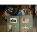 A large collection of vintage postcards in albums and loose inc early to mid 20th century ephemera.