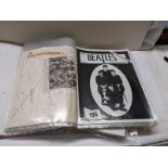 A folder of The Beatles press photos, press releases and newspaper stories.