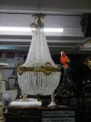 A fabulous brass 'basket' chandelier with over 4000 crystals. COLLECT ONLY.