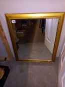 A gilt framed mirror - 61cm x 71cm (COLLECT ONLY)