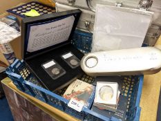 A collection of coin sets including 2000 time capsule, Brexit 50p pair, Navy 100 years £2, Da Vinci
