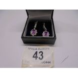 A pair of 18ct white gold pink sapphire and diamond earrings.