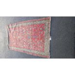 A medium early Moroccan floral red rug - 190cm x 108cm (COLLECT ONLY)