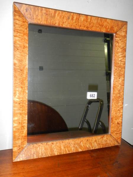 A bird's eye maple framed mirror.