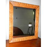 A bird's eye maple framed mirror.