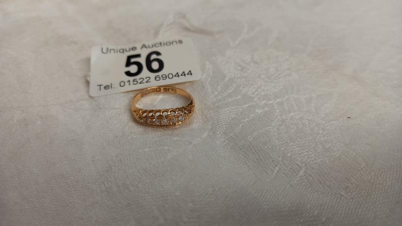 A diamond seven stone ring dated and hall marked Birmingham 1911, 18ct, size N, 2.4 grams.