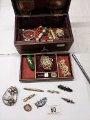 A quantity of antique and vintage jewellery, some gold and silver included, in a jewellery box.