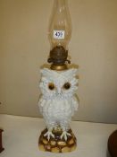 A ceramic oil lamp in the form of an owl with crossed swords mark.