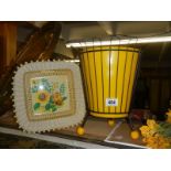 A retro waste bin and fruit basket.