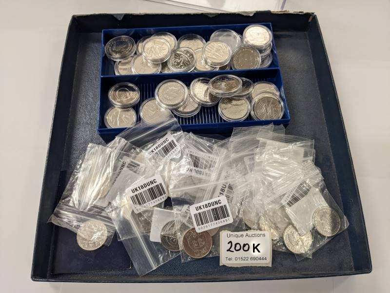 A collection of approximately 52 uncirculated alphabet 10p coins.
