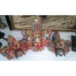 3 ornately carved and painted wall maske