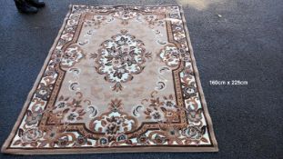 A beige coloured rug - 160cm x 225cm (COLLECT ONLY)