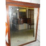 A large mahogany framed bevel edged mirror.