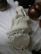 An early Victorian Copeland white porcelain figure complete with wall bracket.