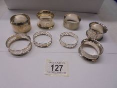Eight hall marked silver napkin rings, 90 grams.