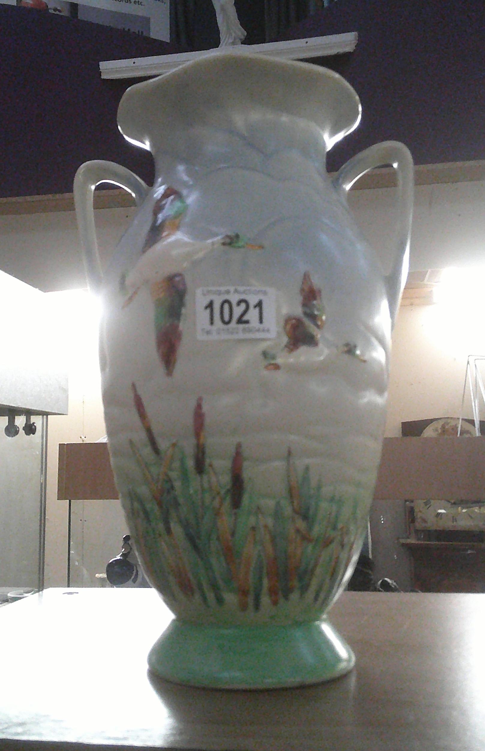 A tall pottery Shorter and Sons vase of ducks flying over reeds height 31cm