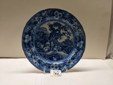 A late 19th century soft paste blue and white Delft style plate.