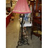 A 19th century wrought iron standard lamp with shade, COLLECT ONLY.